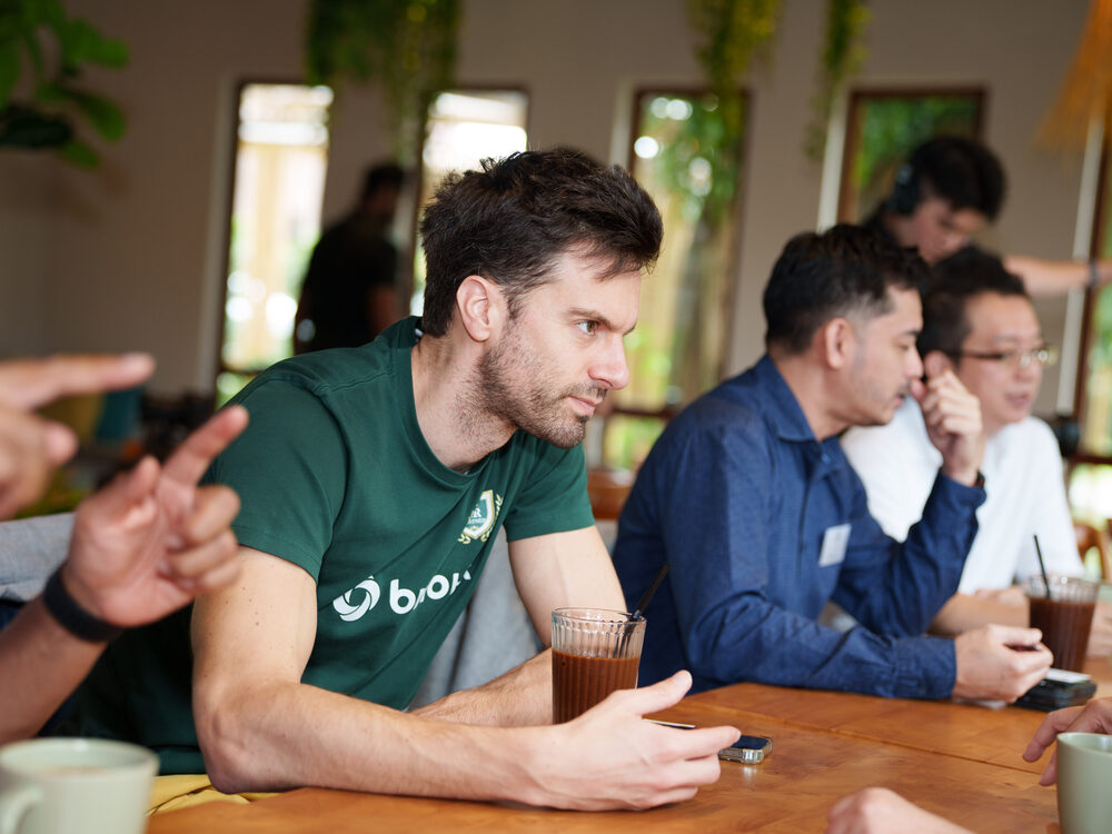 Members in conversation around a table